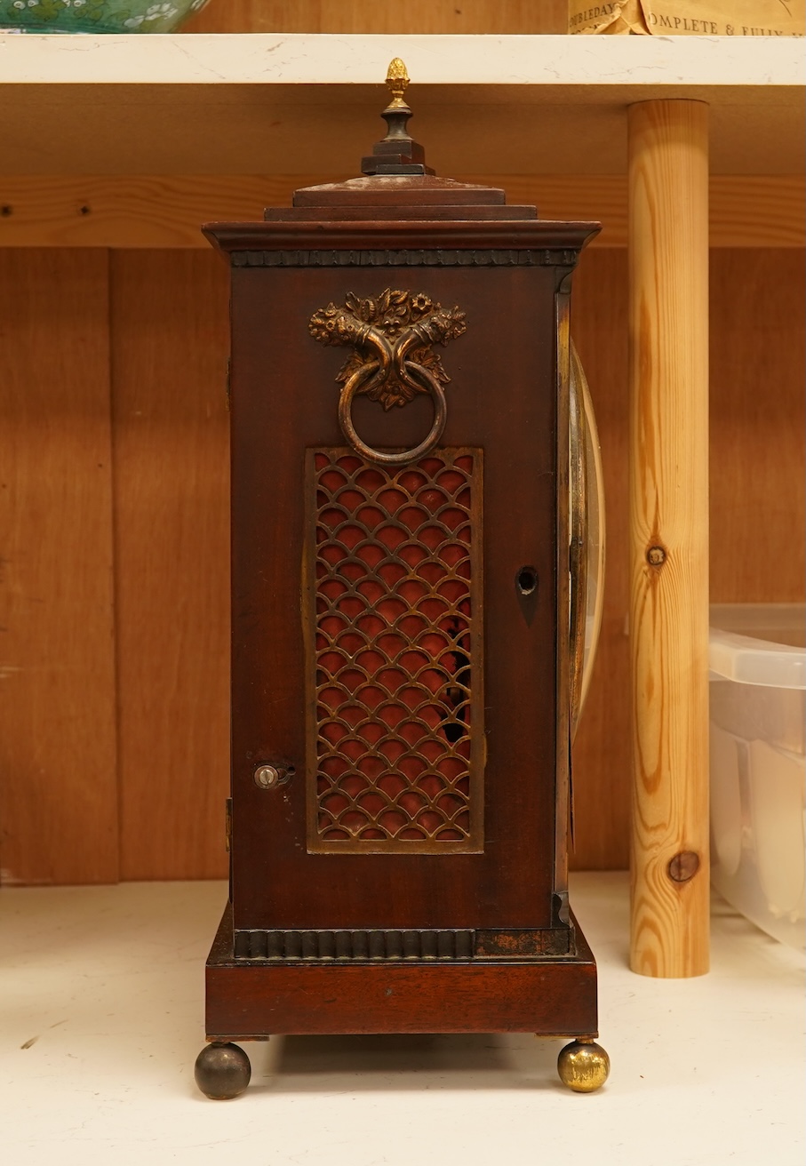 An early 19th century rosewood and brass bracket clock, striking on a bell, with pendulum and key, 47cm high